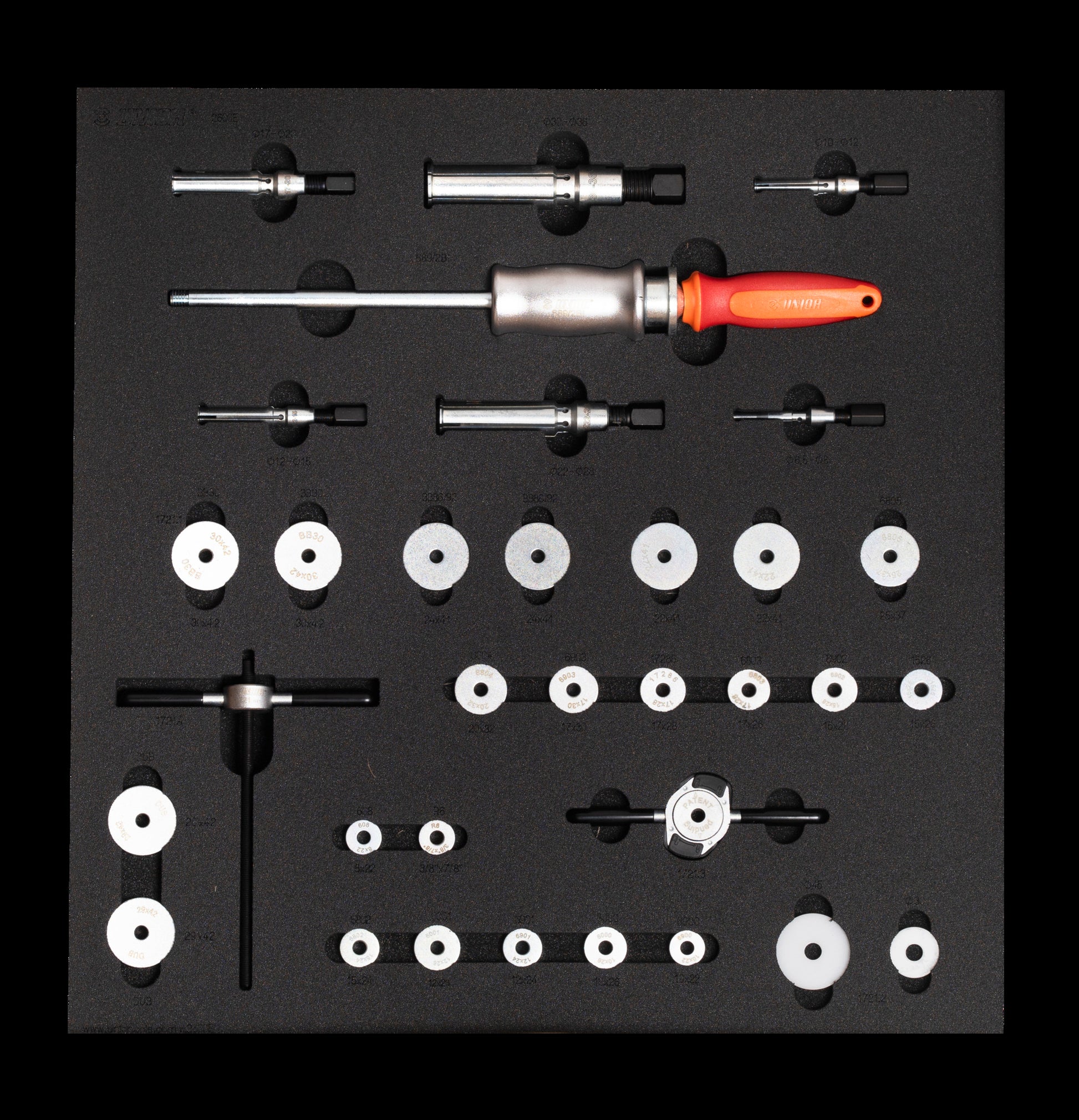 Unior SET-2600E-US bearing service tray from above: slide-hammer puller with six expandable collets, 1721 press spindle and handles, 21 bearing press adaptors and two carbon protectors in cut-out foam