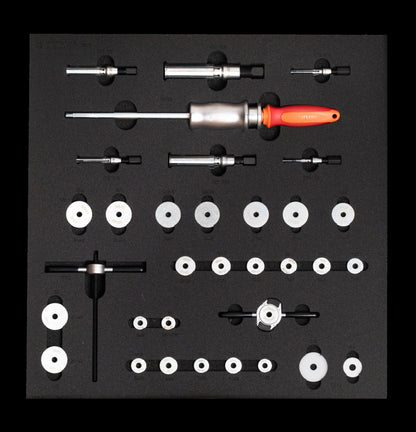 Unior SET-2600E-US bearing service tray from above: slide-hammer puller with six expandable collets, 1721 press spindle and handles, 21 bearing press adaptors and two carbon protectors in cut-out foam