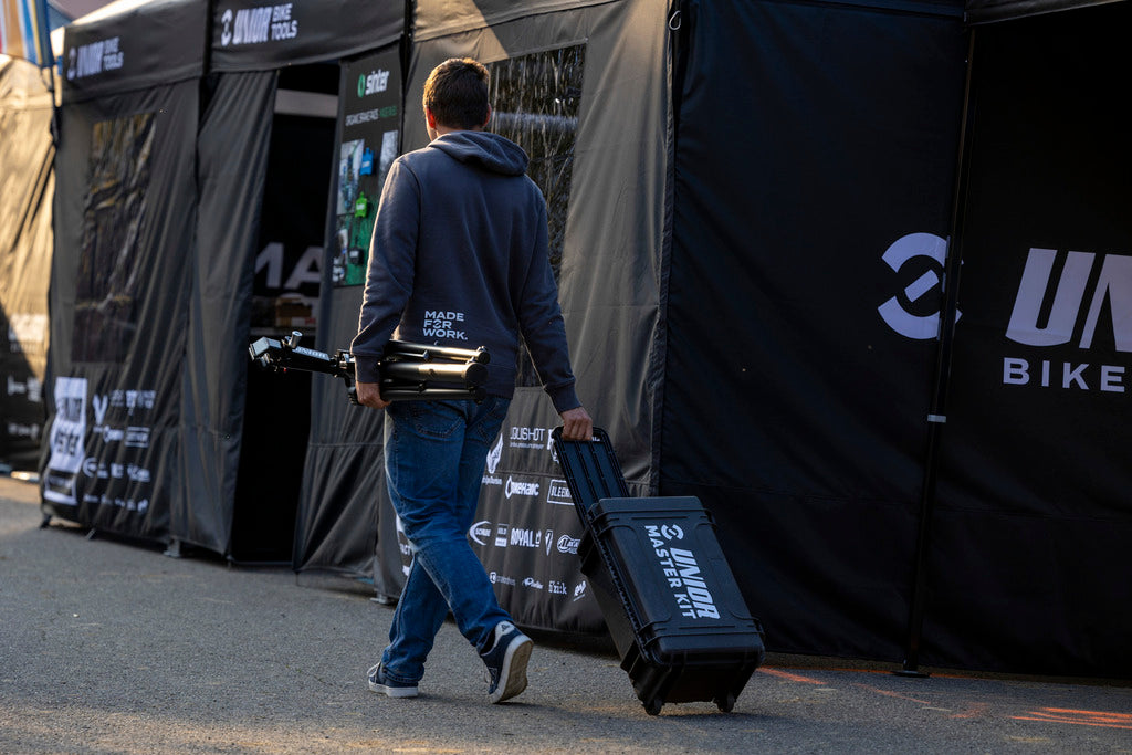 Master Tool Kit 2.0 case rolled through a race paddock on its retractable handle - 1600MASTERKIT