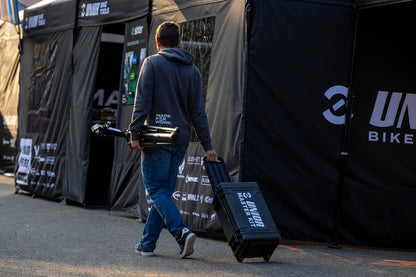 Master Tool Kit 2.0 case rolled through a race paddock on its retractable handle - 1600MASTERKIT