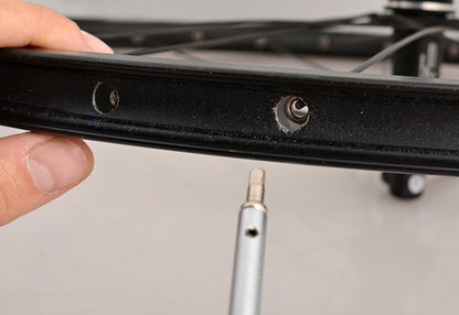 Unior 1751/2Q approaching an inverted square nipple seated in a rim spoke bed