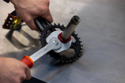 Unior Crowfoot Open-End Wrench 1725/2CF holding a chainring lockring while a second Unior wrench engages the BB spindle