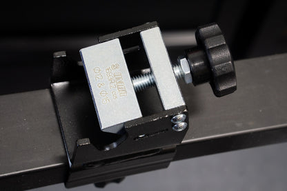 Unior Thru-axle Adaptor 1693R.2 mounted on a Pro Road Stand rail, silver clamping block stamped 12 and 15 mm