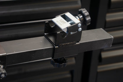 Thru-axle Adaptor 1693R.2 on a Unior Pro Road Stand crossbar, knurled thumb-screw and clamping jaws visible