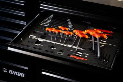 Unior T-handle wrenches in an open workshop drawer, hex and combination tools laid out on black foam