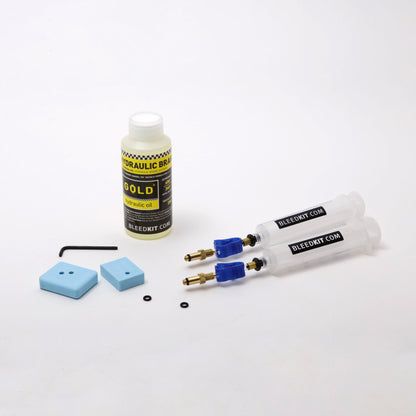 Bleedkit Premium Gold Formula Cura kit overview, Gold mineral oil bottle, Bleedkit syringes, blue pad blocks and hex key