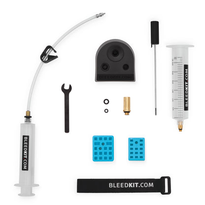 Bleedkit Premium Road kit for Shimano hydraulic disc brakes, syringes, funnel, blue pad spacers, and brass adapter
